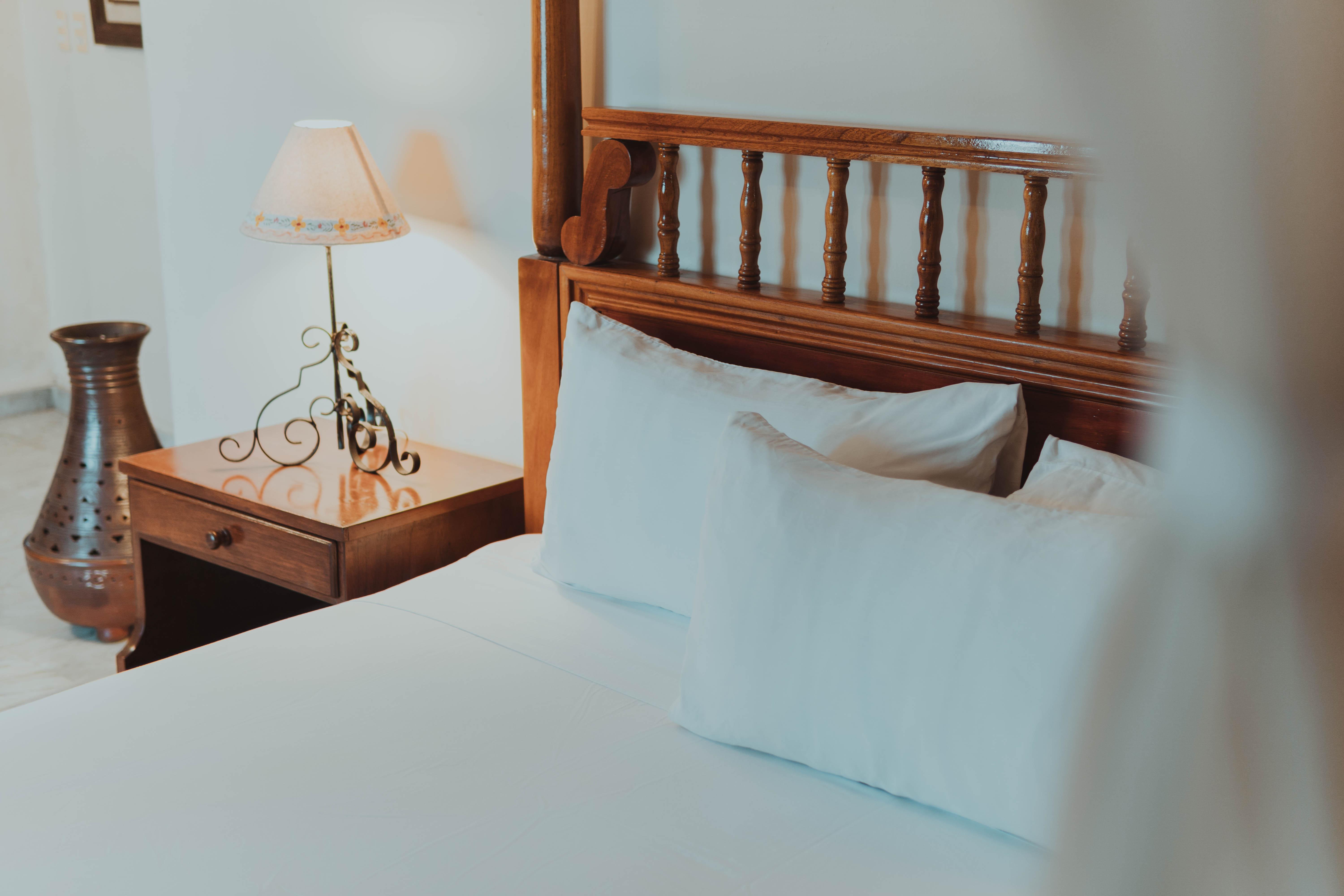 Casa Del Balam Мерида Экстерьер фото A bed with a nightstand